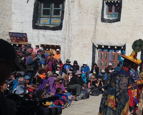Travelers Watching The Tiji Festival Ceremony